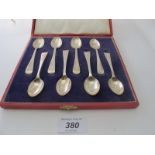 A set of eight plain silver coffee spoons, London 1945, boxed, approx weight 103 grams/3.3 troy oz.