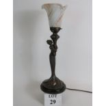 An Art Nouveau style bronze table lamp in the form of an elegant lady,