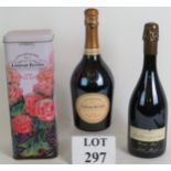 A bottle of Laurent-Perrier cuvee rose brut champagne in a presentation tin,