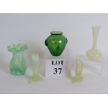 A small green Loetz style teardrop glass vase plus four various pieces of vaseline glass.