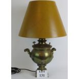 An antique brass Samovar converted into a table lamp with cracked paint effect shade.
