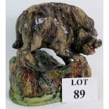 An antique Mafra Portuguese Majolica figure of a wild boar, height 26cm, width 25cm.