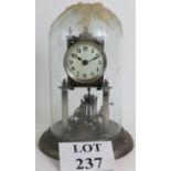 A German silvered brass 400 Day Anniversary clock under a glass dome. Height: 29cm.