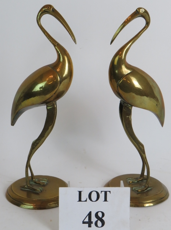 A pair of Early 20th Century hollow brass Ibis figurines, 30cm tall. Condition report: Tarnished.