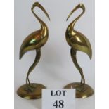 A pair of Early 20th Century hollow brass Ibis figurines, 30cm tall. Condition report: Tarnished.