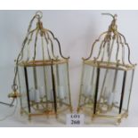 A pair of good quality modern hall lanterns with brass hexagonal glazed lights and six bulb