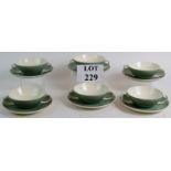 A set of six retro Poole pottery double handled soup bowls and saucers Condition Report: No