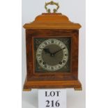 A contemporary walnut striking bracket clock with a Garrard Swindon movement.