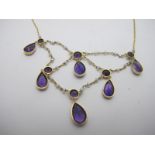 A fine and delicate yellow metal amethyst and seed pearl drop necklace,