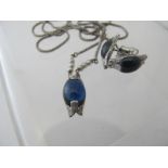 A fine platinum pendant necklace with cabochon cut sapphire,