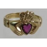 A 9ct gold Irish Claddagh ring set with heart shaped ruby presenting Love, Loyalty & Friendship,