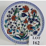A Theodore Deck faience ceramic plate decorated in the Iznik style, Circa 1870.