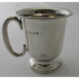 A silver christening mug with raised base and 'C' handle, Birmingham 1935, approx 58 grams/1.