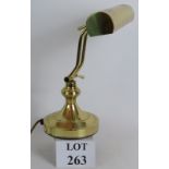 A modern brass banker's style desk lamp, fully adjustable. Height: 33cm.