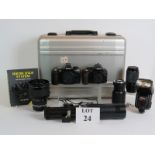 Two Nikon SLR cameras, a D3100 and an F80, a Nikon Speedlite SB25 flashgun, Nikkor 120mm lens,