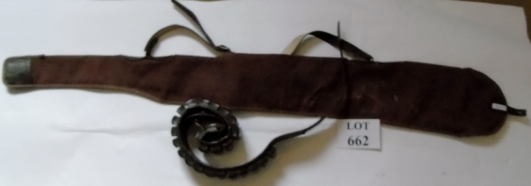 A cartridge belt and gun slip. Condition report: Gun slip has hole in it but usable.
