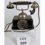 An early Dutch 1920's telephone with integral bell meter and horn mouthpiece.