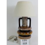 A cool Retro 1970's West German fat lava table lamp with shade and illuminated base.