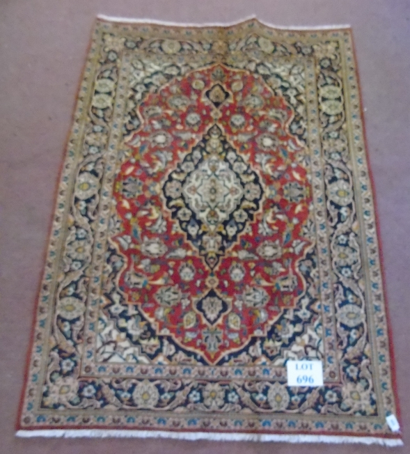 A Persian rug with central pattern on red ground, 146cm x 108cm. - Image 2 of 4
