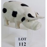 A carved and painted wooden pig from a butcher's shop. Length: 30cm. Height: 18cm.