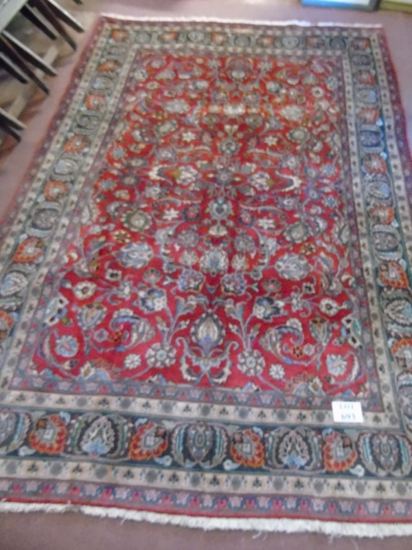 A large Persian carpet on red ground. Possibly Kashan. 2.95m x 2.00m. - Image 2 of 4