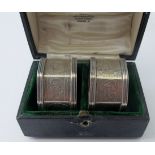 A pair of silver octagonal shaped engraved napkin rings monogrammed, Sheffield 1898, boxed.