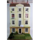 A large scratch built dolls house and contents in the form of a four storey Georgian town house.