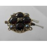 An early 20th century 9ct gold garnet and seed pearl clasp. Condition Report: Good condition.
