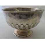 A silver rose bowl featuring half spiral fluting to the body and pedestal foot, Birmingham 1906,