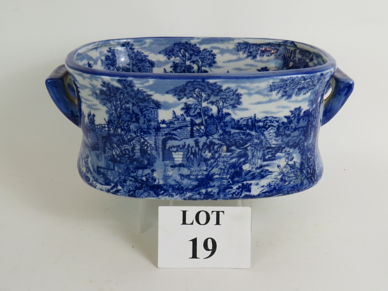 A Victoria Ware Ironstone blue and white transfer printed foot bath with pastoral scenes.