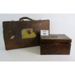 A vintage leather suitcase and contents including roller skates and ice skates, a Retro desk lamp,