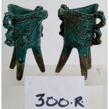 Two Chinese ritual jue green tripod wine vessels, in the Ming style.