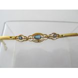 A fine 9ct gold hinged bracelet with openwork central panels,