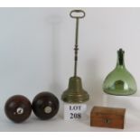 Two vintage Lignum Vitae presentation lawn bowls, a vintage wooden money box and key,