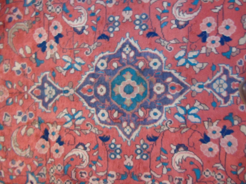 A Hamadan rug on red ground with central motif surrounded by flowers. - Image 3 of 4