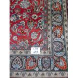 A large Persian carpet on red ground. Possibly Kashan. 2.95m x 2.00m.