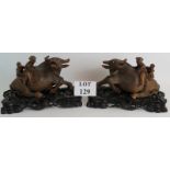 A large pair of 19th Century Chinese root carved buffalo's with children on their backs,