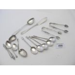 A set of six silver coffee spoons, (one a/f), two pairs of silver sugar tongs, silver butter knife,