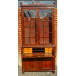 A large 19th Century mahogany secretaire bookcase with double glazed doors to top revealing