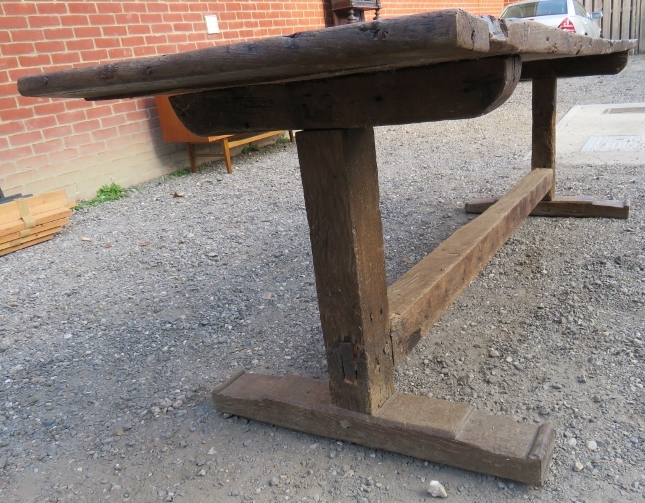 An early rustic three plank refectory dining / kitchen table with a centre lower stretcher bearing - Image 4 of 5