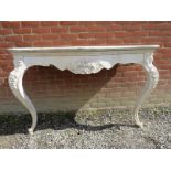 A large 19th Century carved oak console table with a white painted base having a single blind