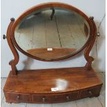 A George III mahogany inlaid bow front table top mirror, with three small drawers and brass handles.