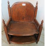 A 19th century rustic folk art child's chair with turned spindles to arms.