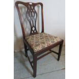 A Georgian mahogany framed lattice back elbow chair with a tapestry upholstered seat.