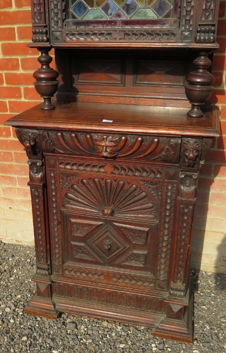 A tall 19th Century carved oak Flemish cabinet with an arched leaded stained glass cupboard to top - Image 4 of 4