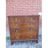 A Georgian mahogany chest of two over three long drawers terminating on bracket feet.