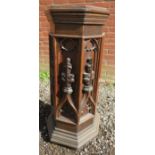 An ecclesiastical carved oak pedestal with five detailed carved sections.