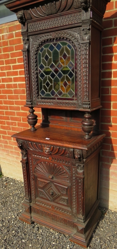 A tall 19th Century carved oak Flemish cabinet with an arched leaded stained glass cupboard to top - Image 2 of 4
