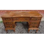 A 19th Century walnut desk by Maple & Co of London,