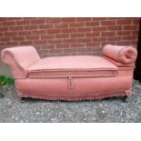A 20th Century small upholstered love seat / window seat with a drop end support to one side and